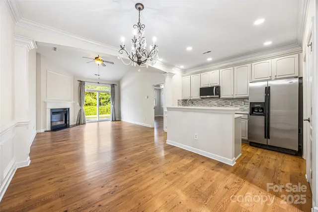 a view of a kitchen with a stove cabinets and wooden floor