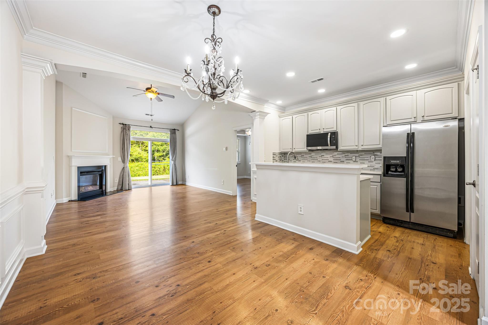 6729 Dusty Saddle Road Charlotte, NC 28277 - Photo 9 of 44 a view of a kitchen with a stove cabinets and wooden floor