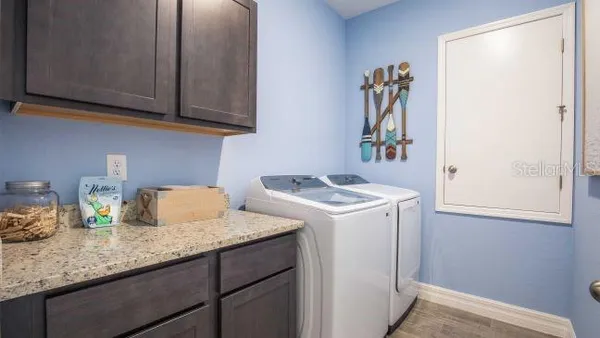 a large kitchen with stainless steel appliances granite countertop a stove and a sink