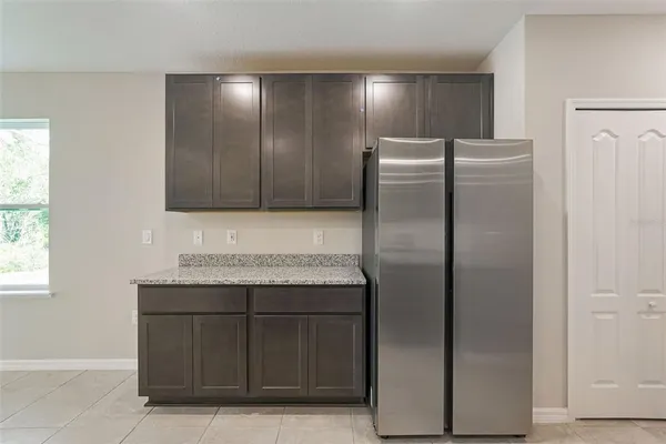 a kitchen with granite countertop stainless steel appliances lots of counter top space