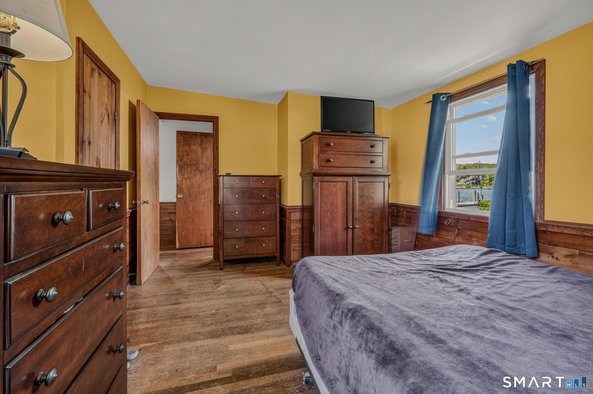 210 Shore Road Waterford, CT 06385 - Photo 25 of 26 a bedroom with a bed and a dresser