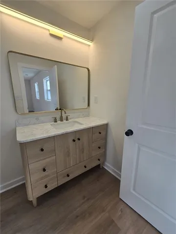a bathroom with a double vanity sink and mirror