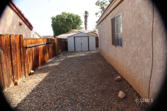 425 Veada Avenue Ridgecrest, CA 93555 - Photo 31 of 35 a view of a house with backyard