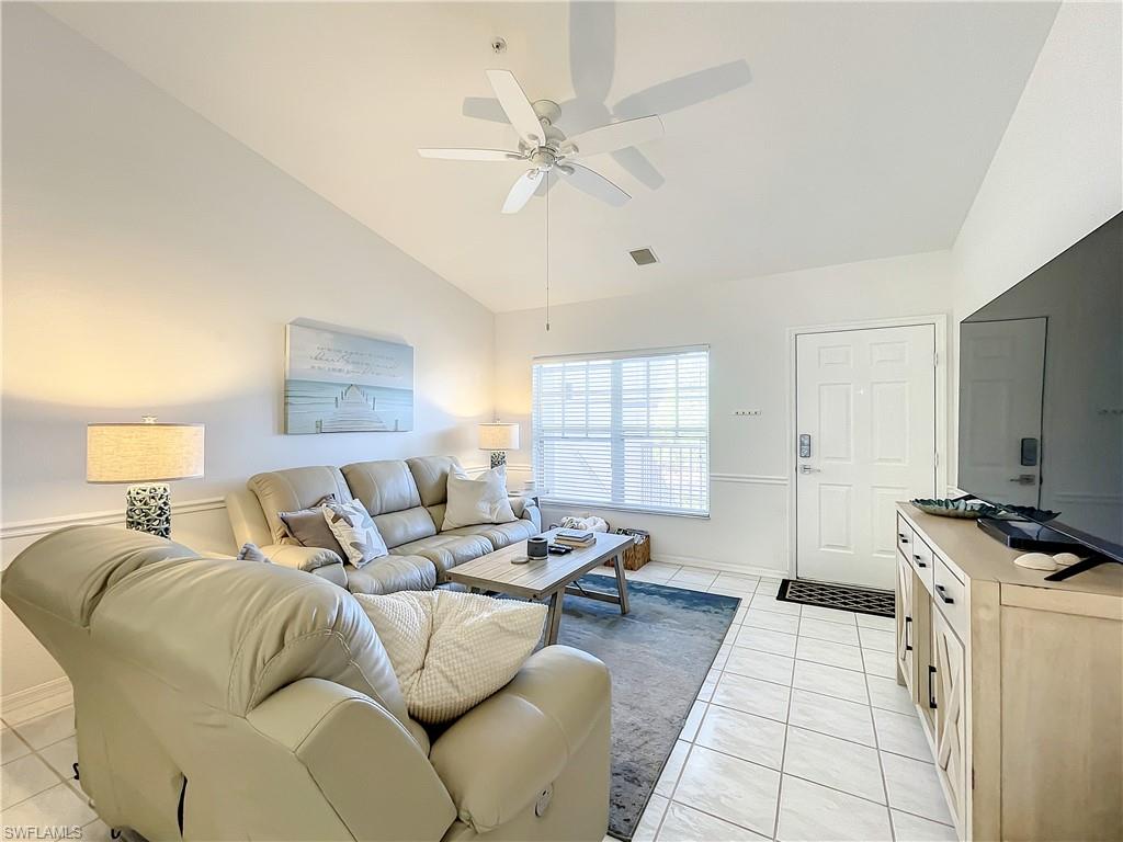470 Bermuda Cove Way, Unit 2303 Naples, FL 34110 - Photo 24 of 48 a bedroom with furniture and a window