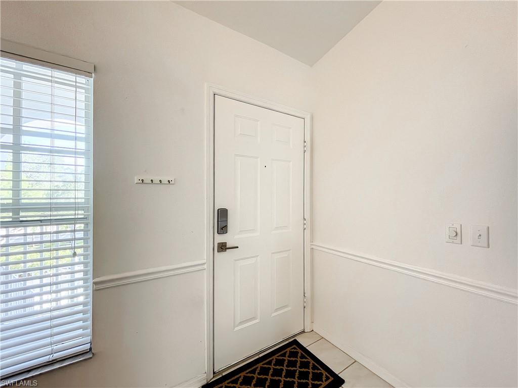 470 Bermuda Cove Way, Unit 2303 Naples, FL 34110 - Photo 32 of 48 a bathroom with a glass shower door