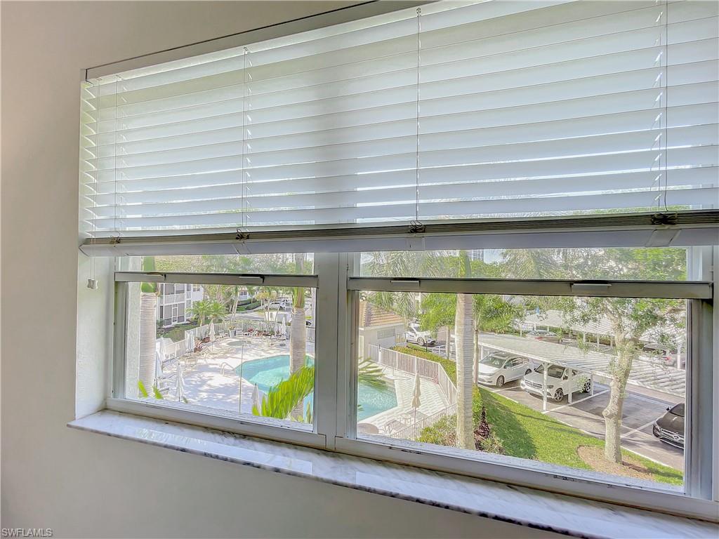 470 Bermuda Cove Way, Unit 2303 Naples, FL 34110 - Photo 33 of 48 a view of a window with an outdoor space