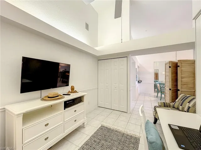 a room with furniture and flat screen tv