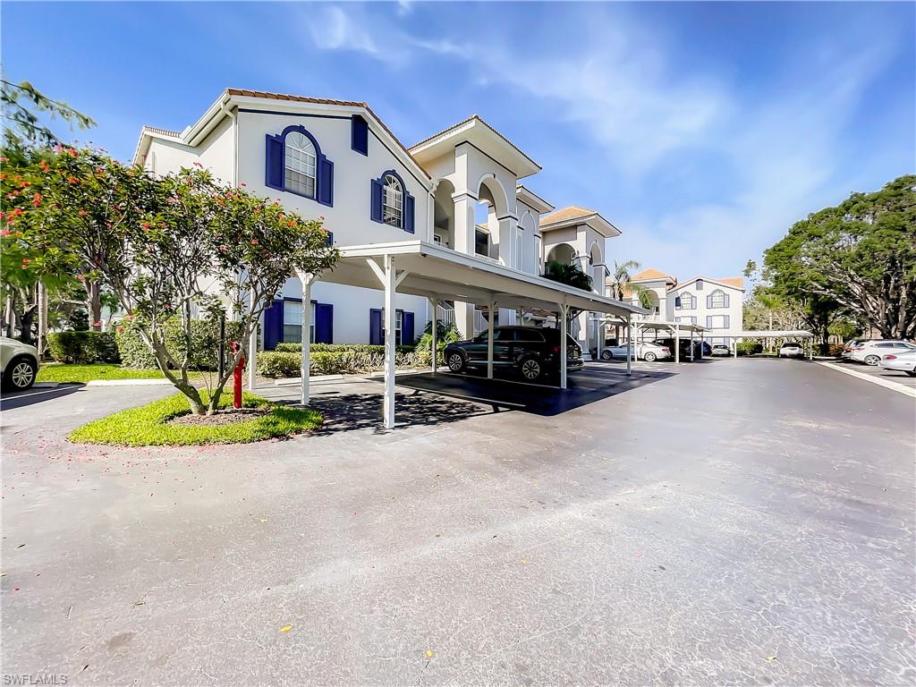 470 Bermuda Cove Way, Unit 2303 Naples, FL 34110 - Photo 41 of 48 a view of multiple houses with a yard