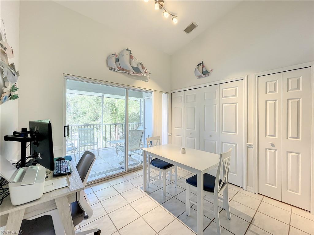 470 Bermuda Cove Way, Unit 2303 Naples, FL 34110 - Photo 45 of 48 a living room with furniture and a window