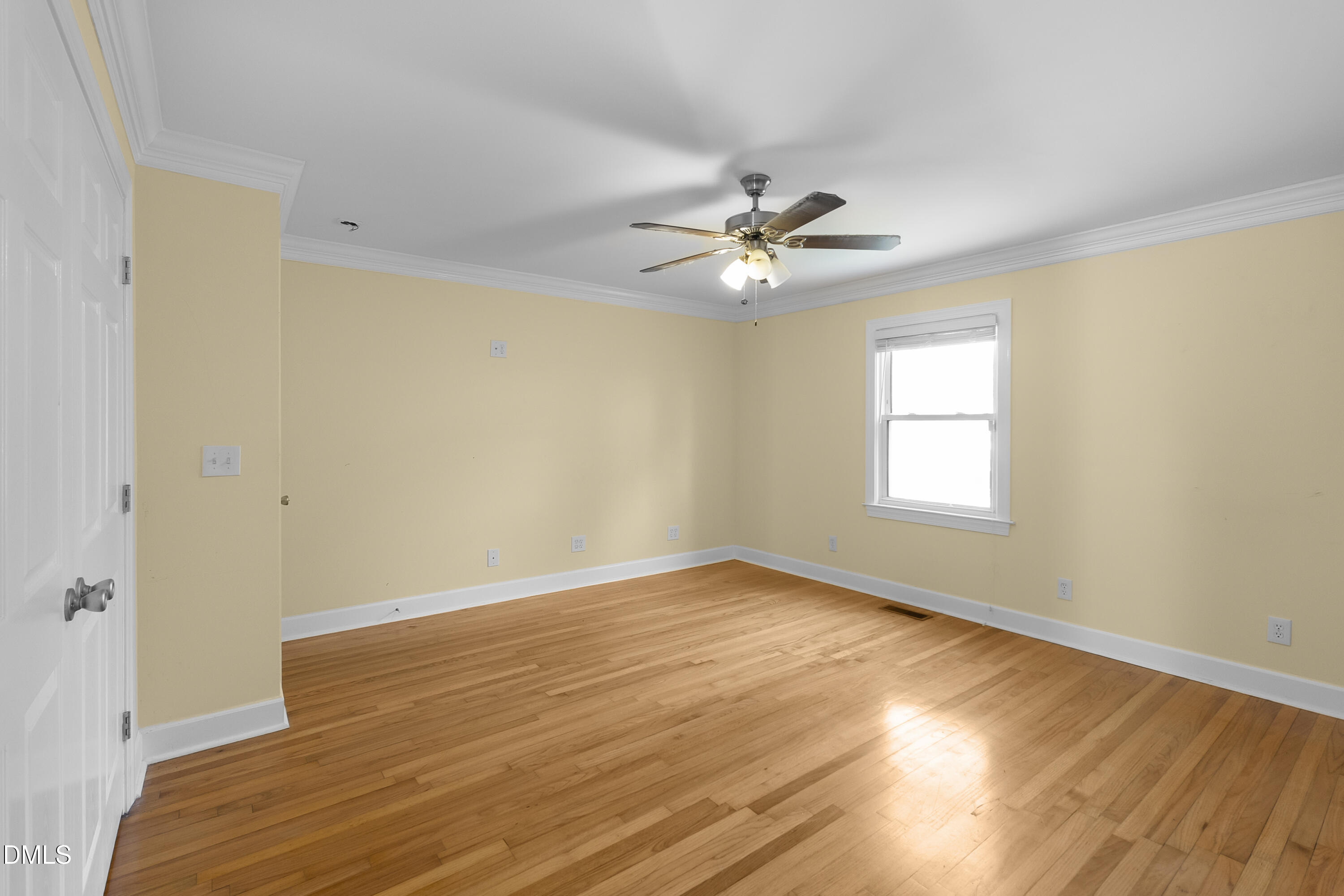5575 Straw Pond School Road Godwin, NC 28344 - Photo 23 of 66 a view of an empty room with wooden floor and a window