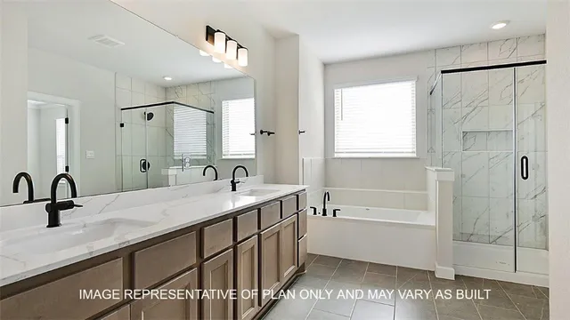 a bathroom with a tub sink and mirror