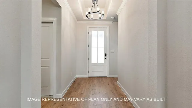 a view of a livingroom with wooden floor and window
