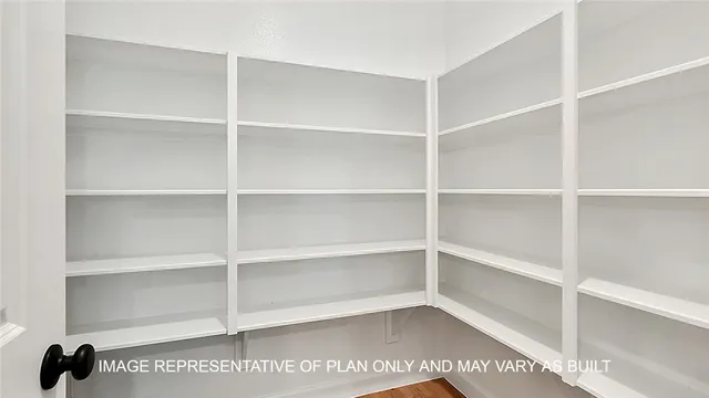 a view of a room with shelf on the wall