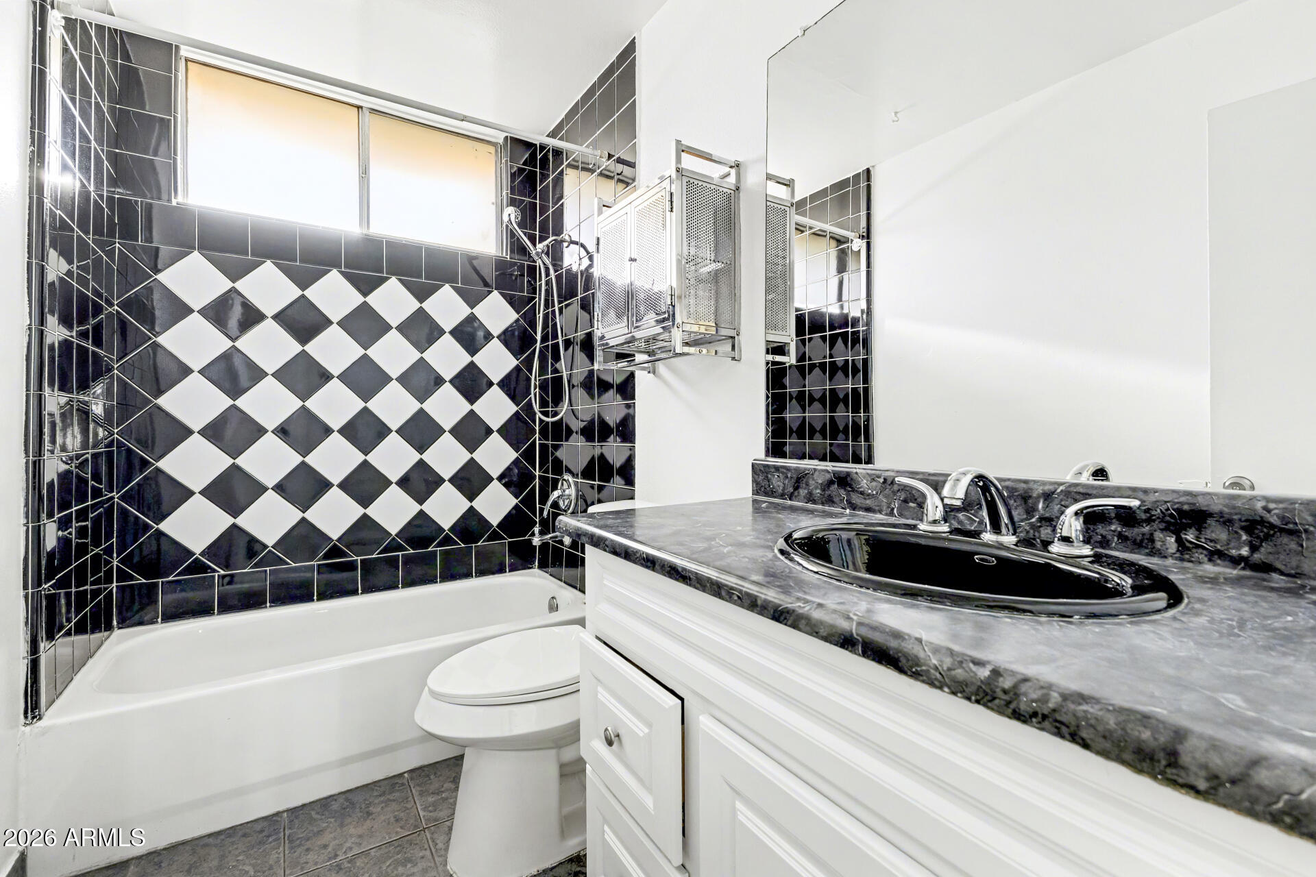 6767 North 7th Street, Unit 217 Phoenix, AZ 85014 - Photo 18 of 31 a bathroom with a granite countertop sink and a mirror