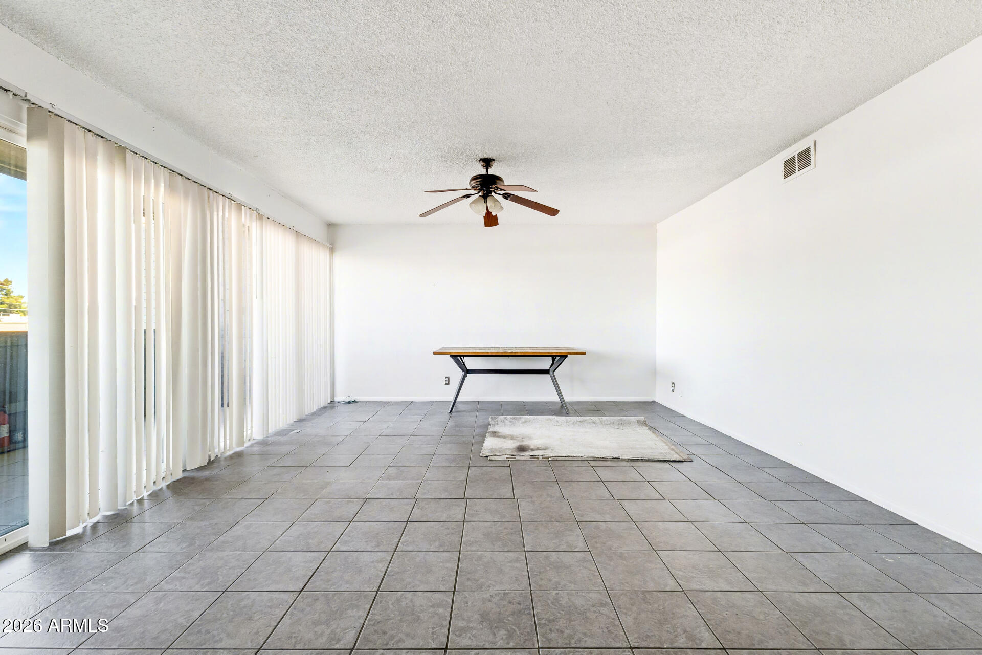 6767 North 7th Street, Unit 217 Phoenix, AZ 85014 - Photo 6 of 31 a view of an empty room and a window