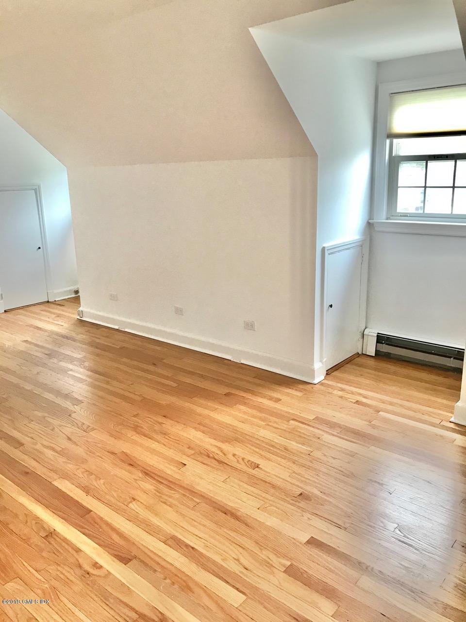 7 River Lane Cos Cob, CT 06807 - Photo 14 of 21 an empty room with wooden floor and windows