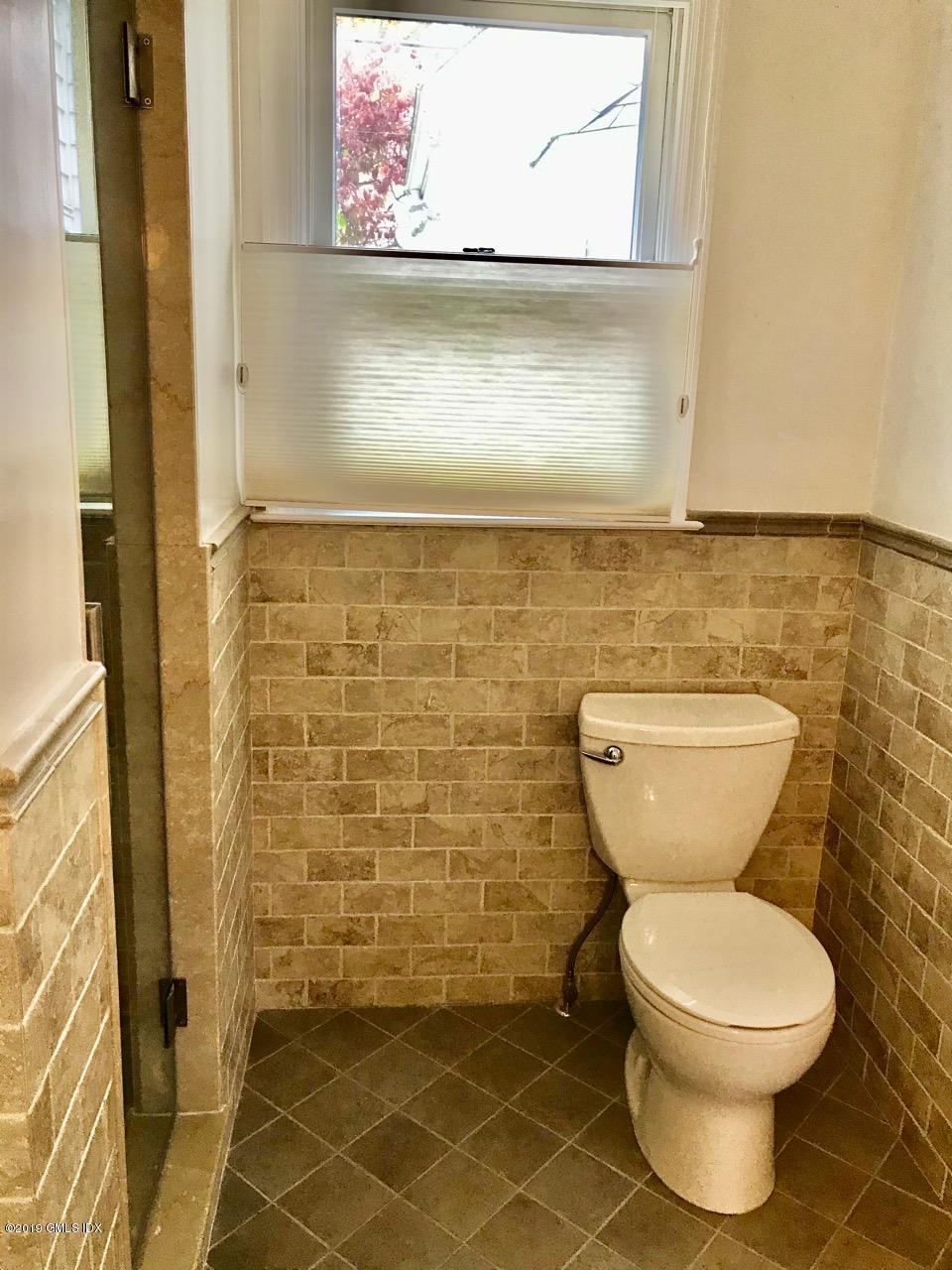 7 River Lane Cos Cob, CT 06807 - Photo 16 of 21 a bathroom with a toilet and a shower