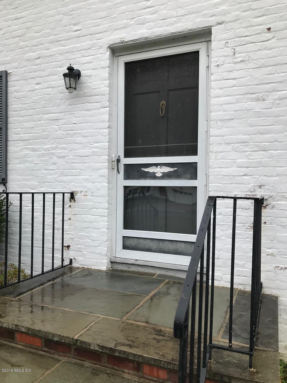 7 River Lane Cos Cob, CT 06807 - Photo 18 of 21 a front view of a house with stairs