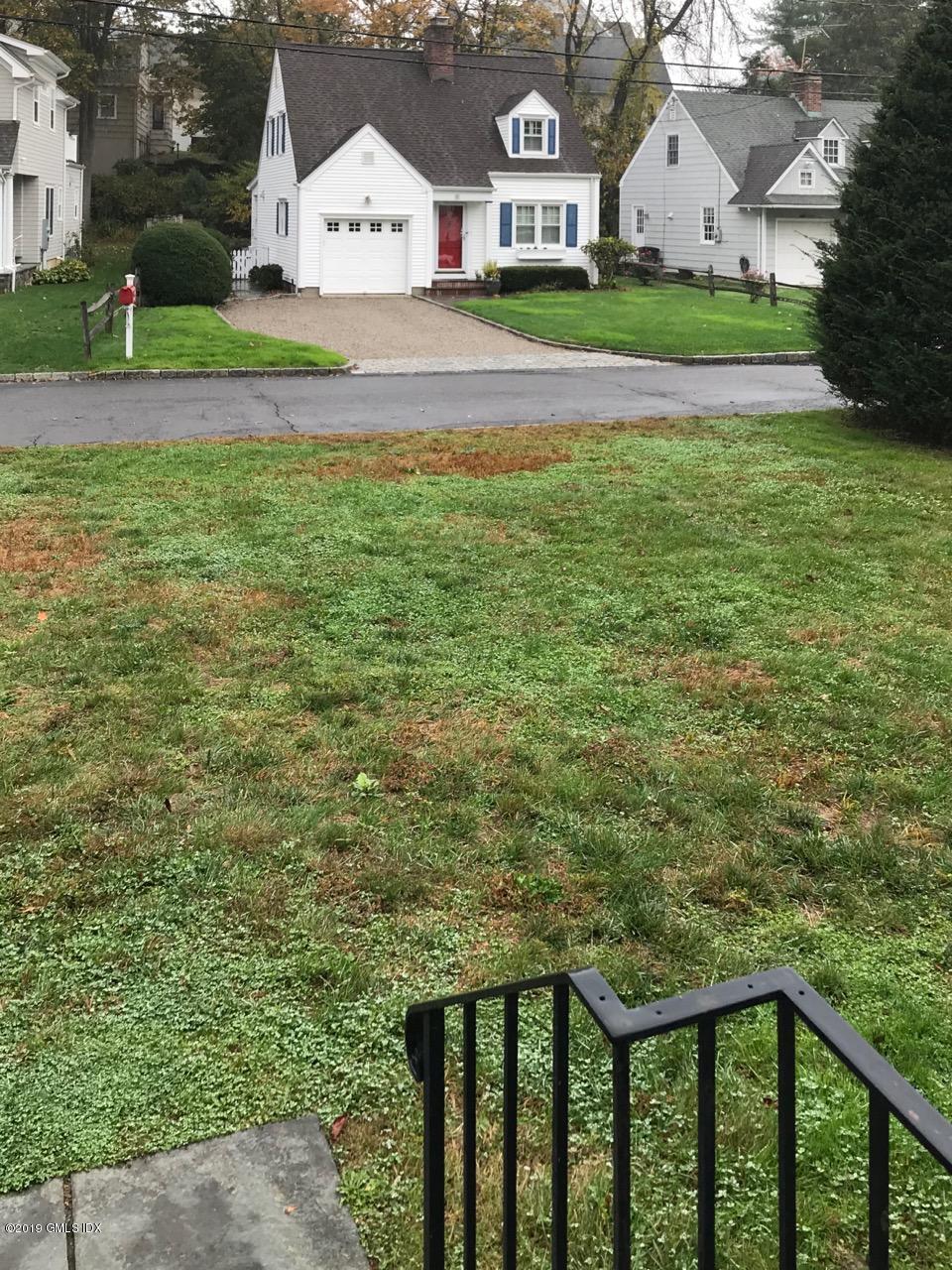 7 River Lane Cos Cob, CT 06807 - Photo 19 of 21 a view of a house with a yard