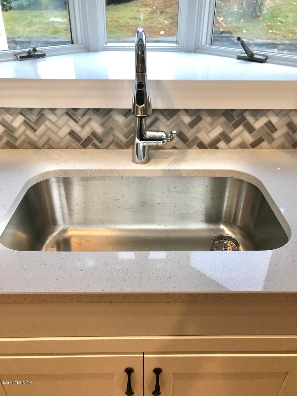 7 River Lane Cos Cob, CT 06807 - Photo 7 of 21 a close view of sink and tap