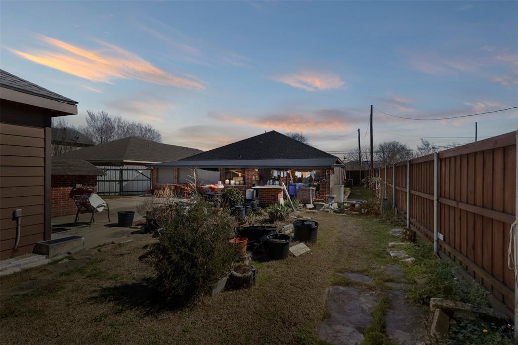 3809 Peachtree Road Balch Springs, TX 75180 - Photo 7 of 27 View of yard with a patio and a fenced backyard
