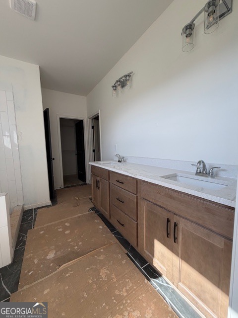 226 Robert Williams Road Pine Mountain, GA 31822 - Photo 24 of 34 a spacious bathroom with a double vanity sink and a mirror