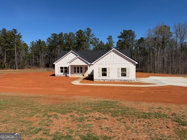 226 Robert Williams Road Pine Mountain, GA 31822 - Photo 33 of 34 a white house with a yard and wooden fence