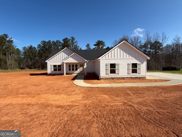 226 Robert Williams Road Pine Mountain, GA 31822 - Photo 34 of 34 a white house with a yard and wooden fence