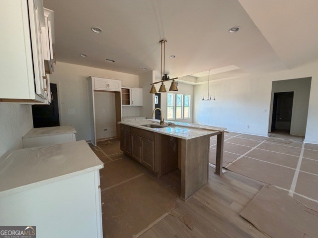 226 Robert Williams Road Pine Mountain, GA 31822 - Photo 8 of 34 a large kitchen with granite countertop a sink and cabinets