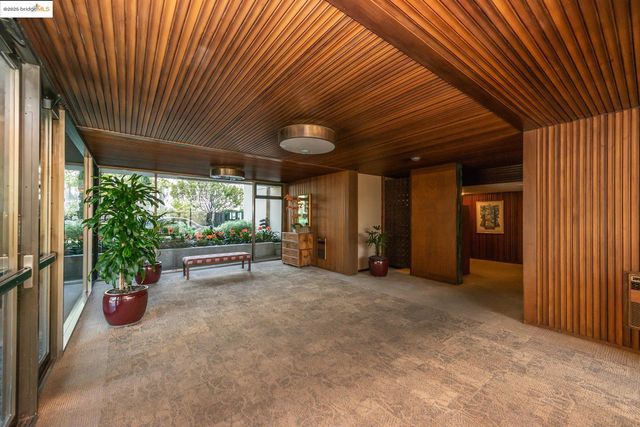 an empty room with furniture and a window