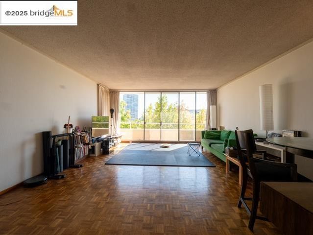 a living room with fireplace furniture and a large window