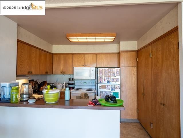 a kitchen with stainless steel appliances a refrigerator and a sink