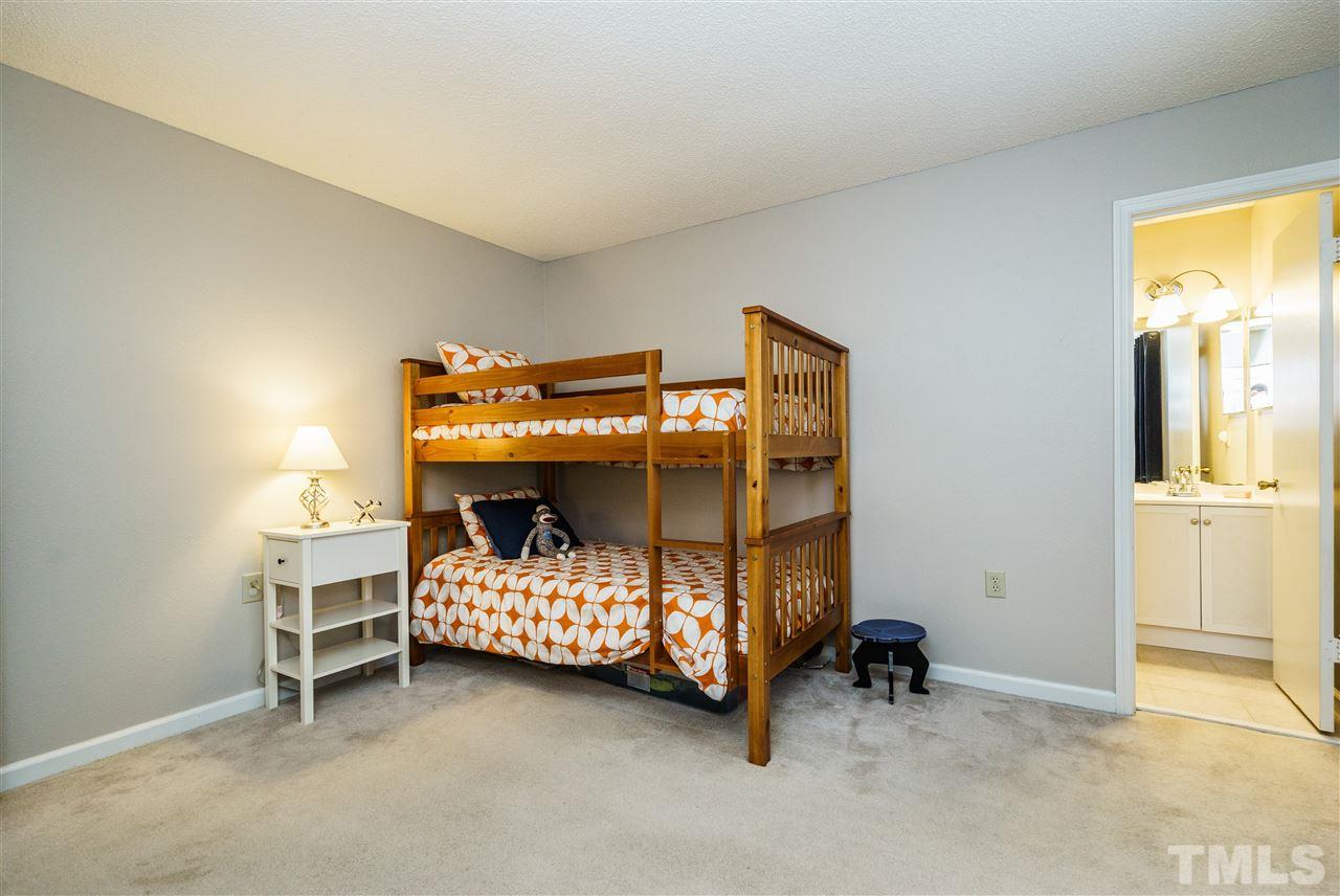 7634 Falcon Rest Circle, Unit 7634 Raleigh, NC 27615 - Photo 20 of 25 a bedroom with a bed and a window