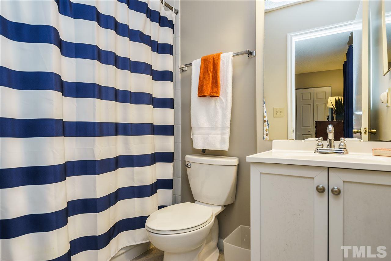7634 Falcon Rest Circle, Unit 7634 Raleigh, NC 27615 - Photo 21 of 25 a bathroom with a sink toilet and shower