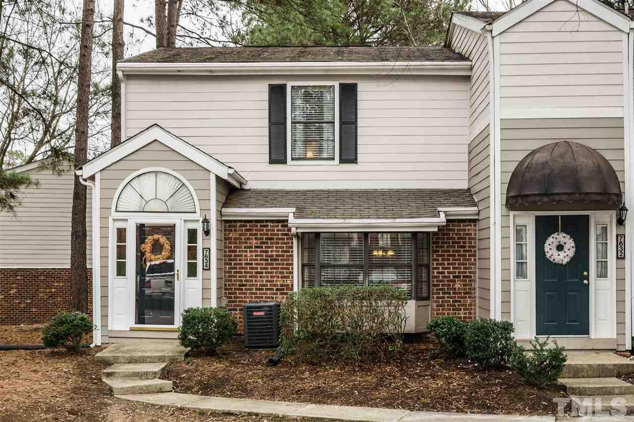 7634 Falcon Rest Circle, Unit 7634 Raleigh, NC 27615 - Photo 24 of 25 a front view of a house with garden