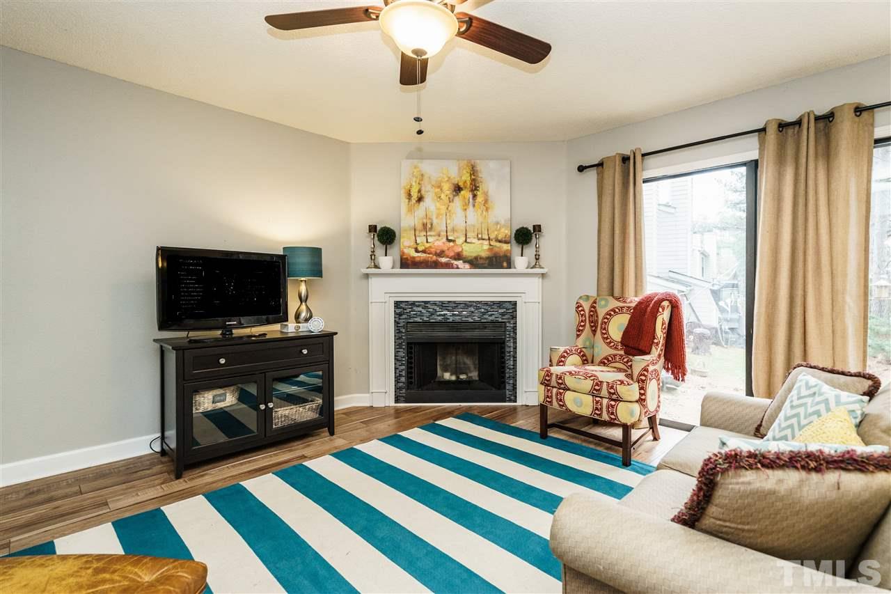 7634 Falcon Rest Circle, Unit 7634 Raleigh, NC 27615 - Photo 6 of 25 a living room with furniture and a fireplace