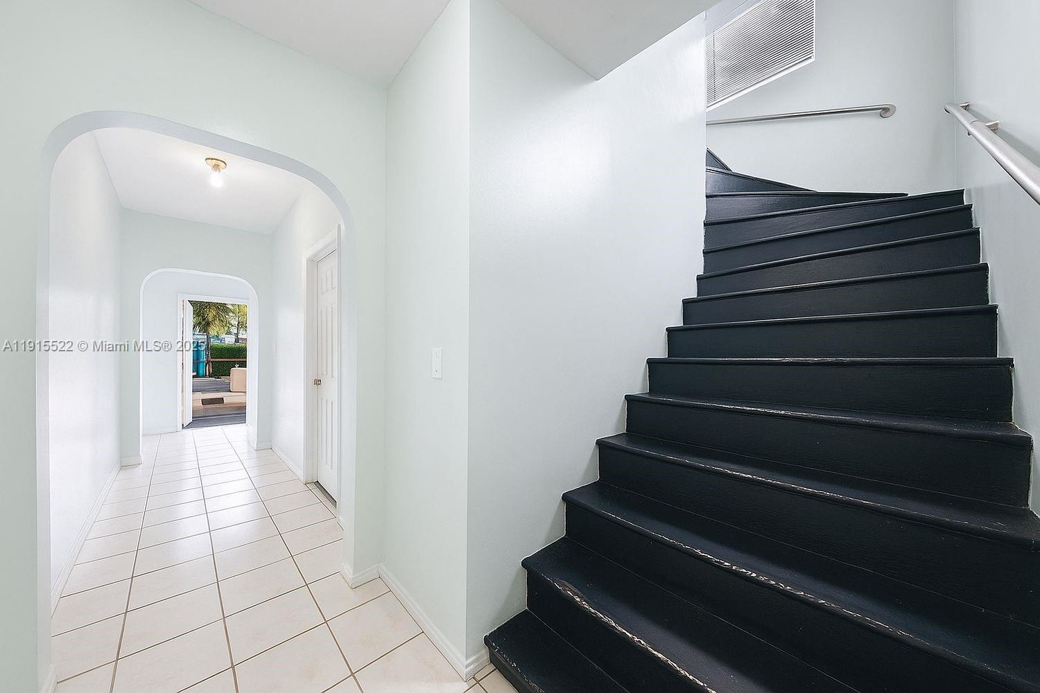 137 Northeast 46th Street Miami, FL 33137 - Photo 8 of 12 a view of entryway and hall with wooden floor