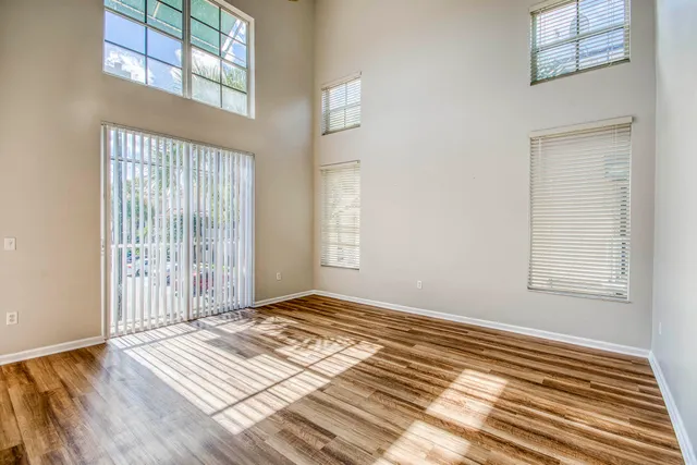a view of a room with wooden floor and stairs