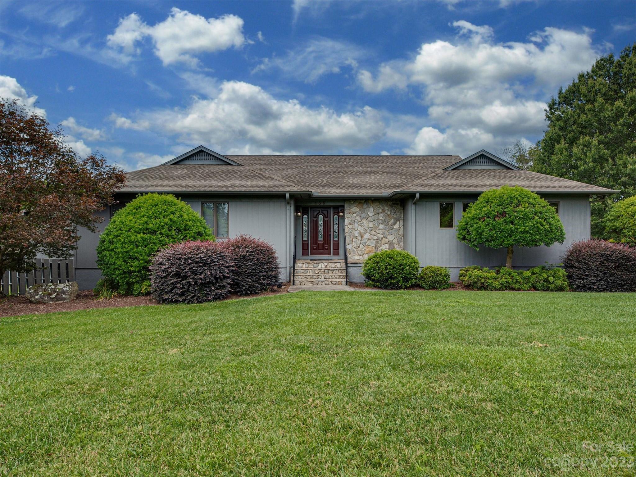 136 Patrick Road Gastonia, NC 28056 - Photo 1 of 22 a view of a house with a big yard plants and large tree