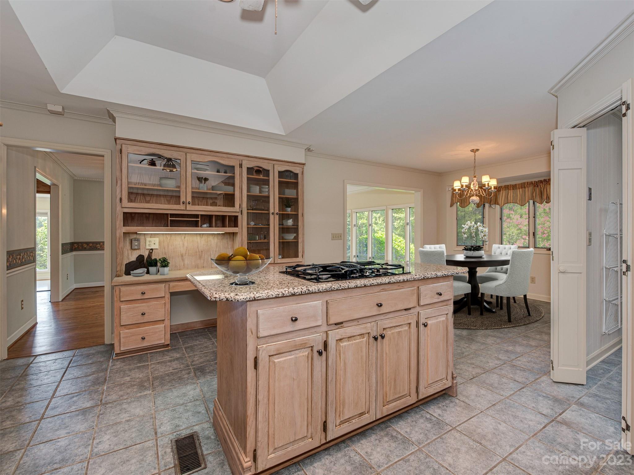 136 Patrick Road Gastonia, NC 28056 - Photo 12 of 22 a kitchen with kitchen island granite countertop a stove a sink and a refrigerator