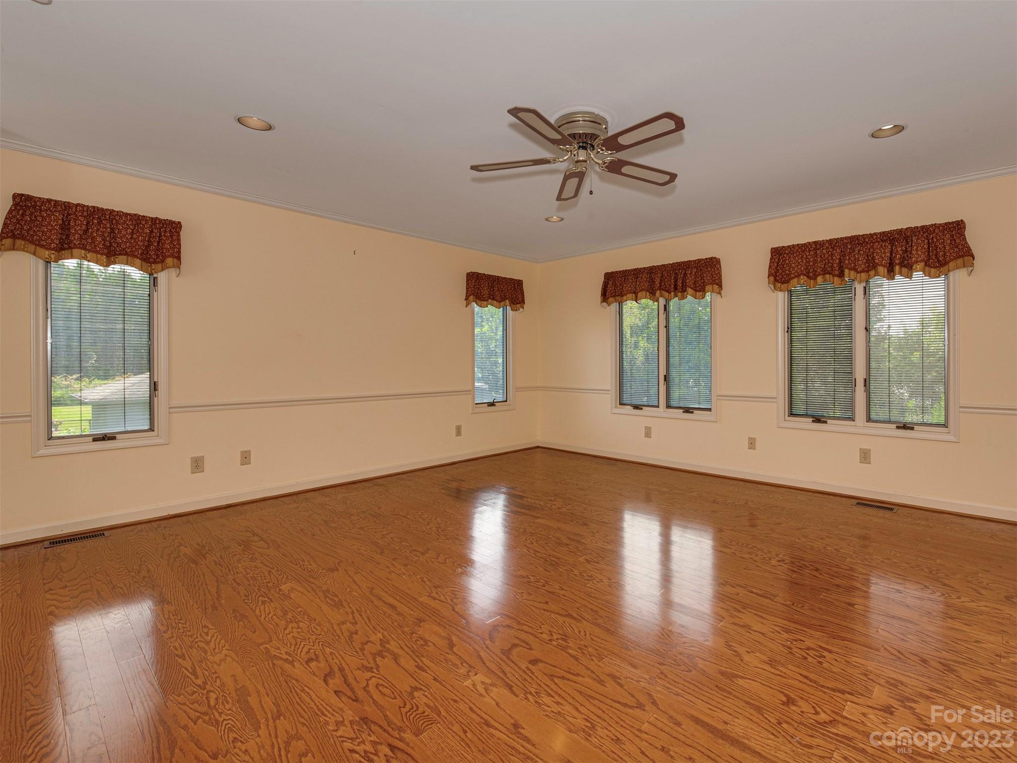 136 Patrick Road Gastonia, NC 28056 - Photo 13 of 22 a view of an empty room with wooden floor and a window