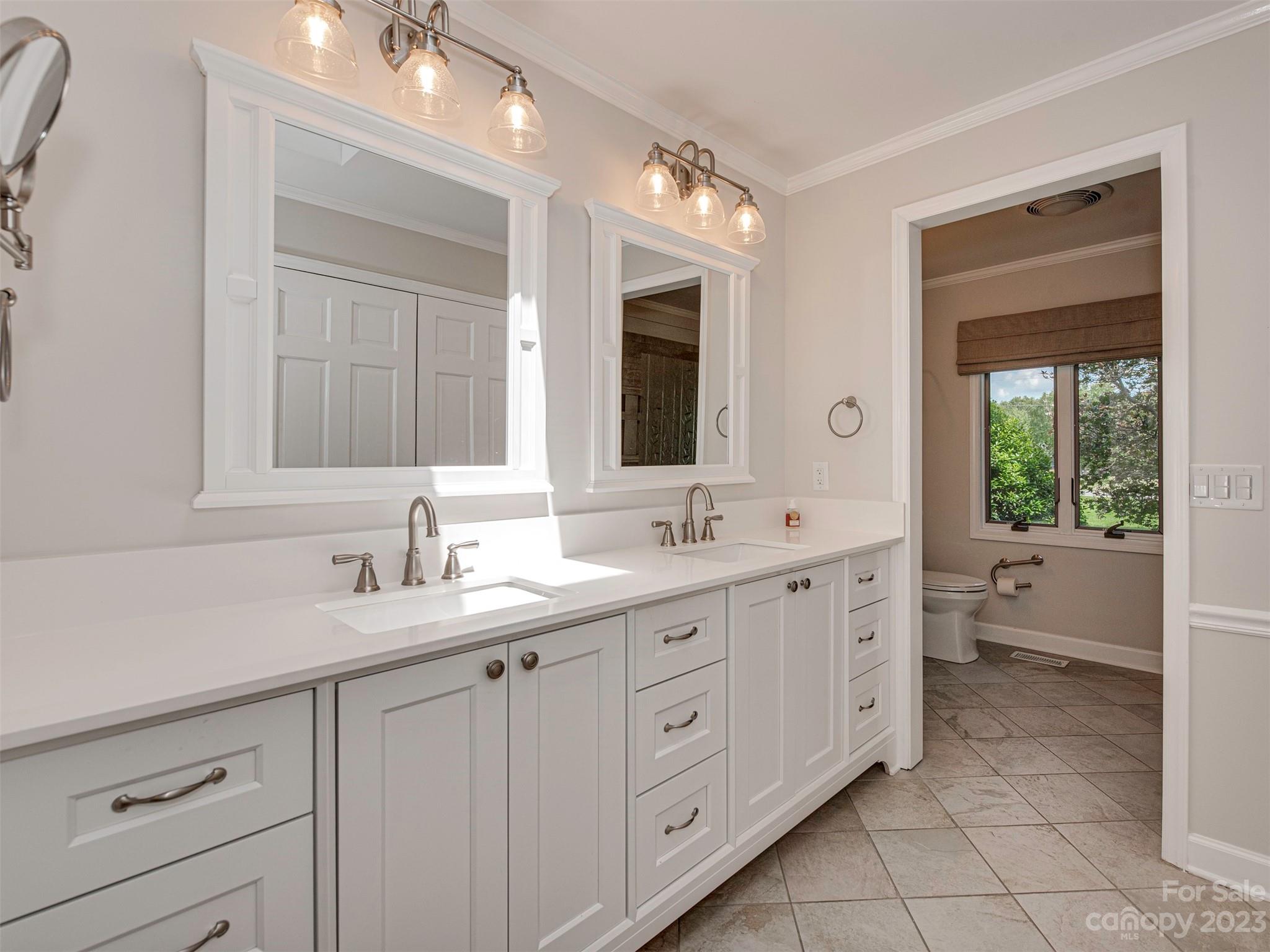 136 Patrick Road Gastonia, NC 28056 - Photo 15 of 22 a spacious bathroom with a double vanity sink a large mirror and a bathtub