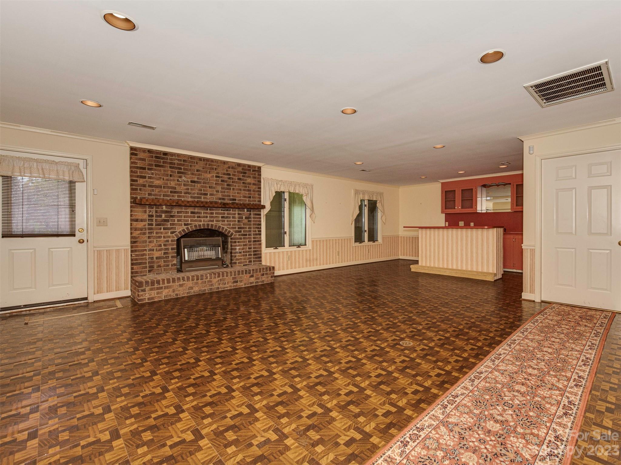 136 Patrick Road Gastonia, NC 28056 - Photo 18 of 22 an empty room with windows and fireplace