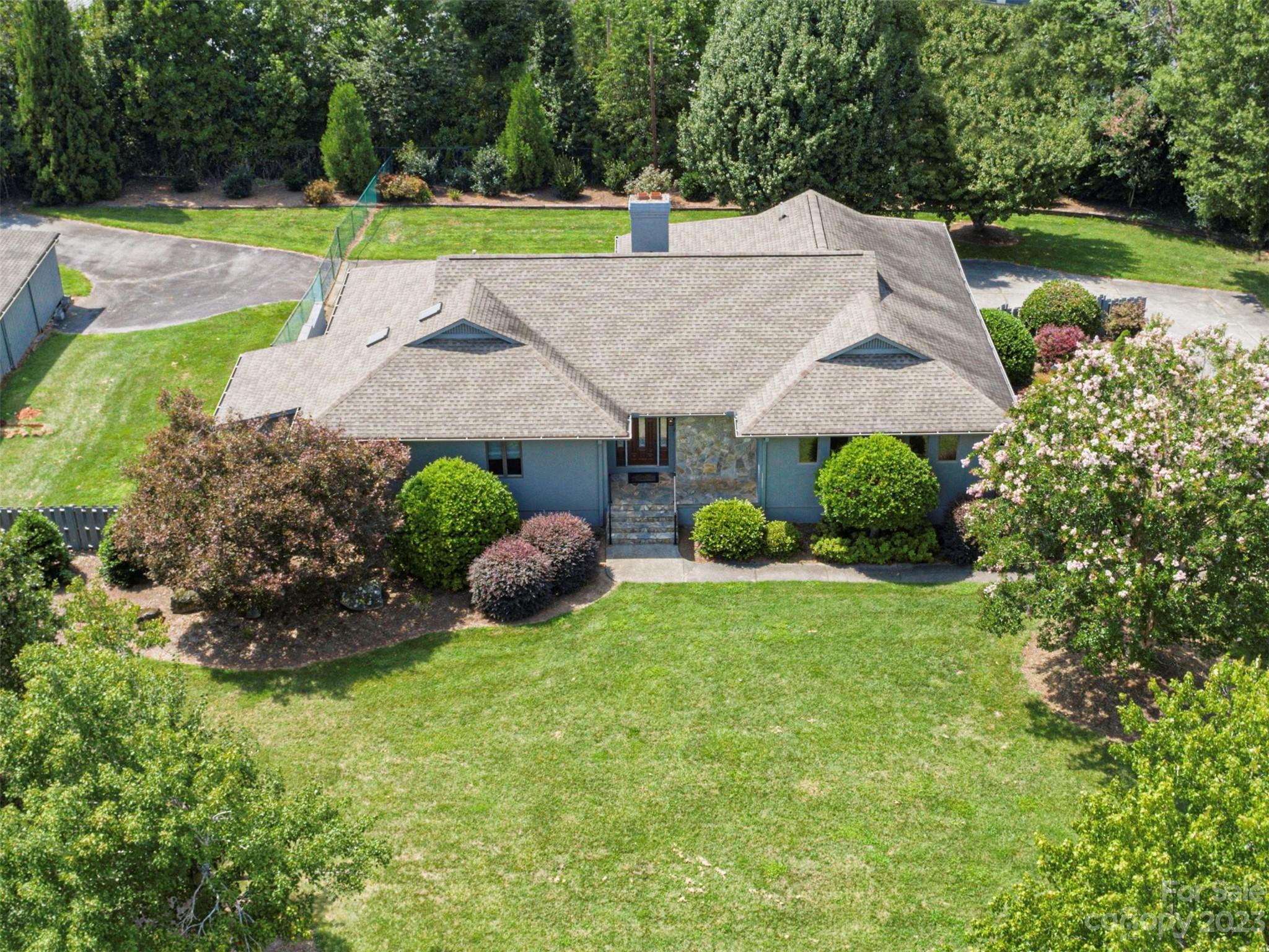 136 Patrick Road Gastonia, NC 28056 - Photo 4 of 22 an aerial view of a house with backyard and pool