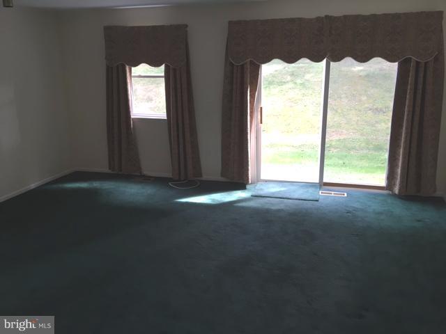 9331 Pan Ridge Road Baltimore, MD 21234 - Photo 5 of 8 a view of a room next to a window