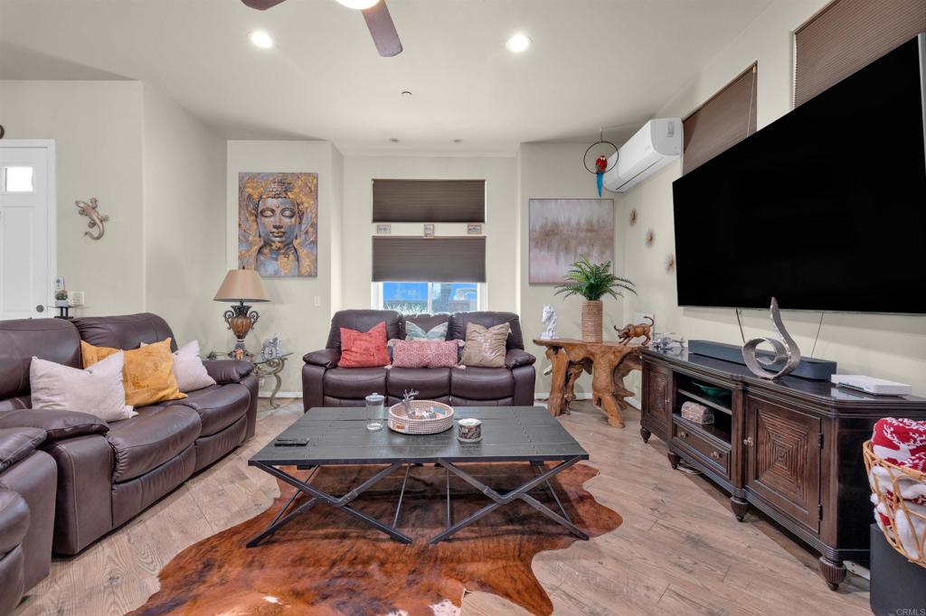 864 Rango Way Borrego Springs, CA 92004 - Photo 7 of 27 a living room with furniture and a flat screen tv