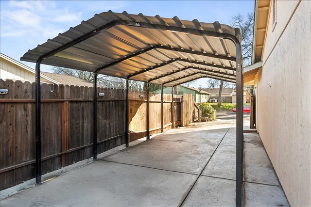 a view of a wooden door with a house