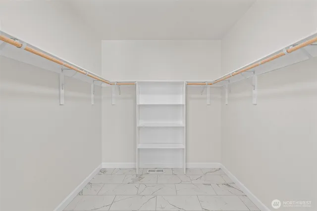 a view of an empty walk in closet