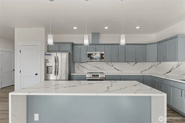 a view of a kitchen with a sink