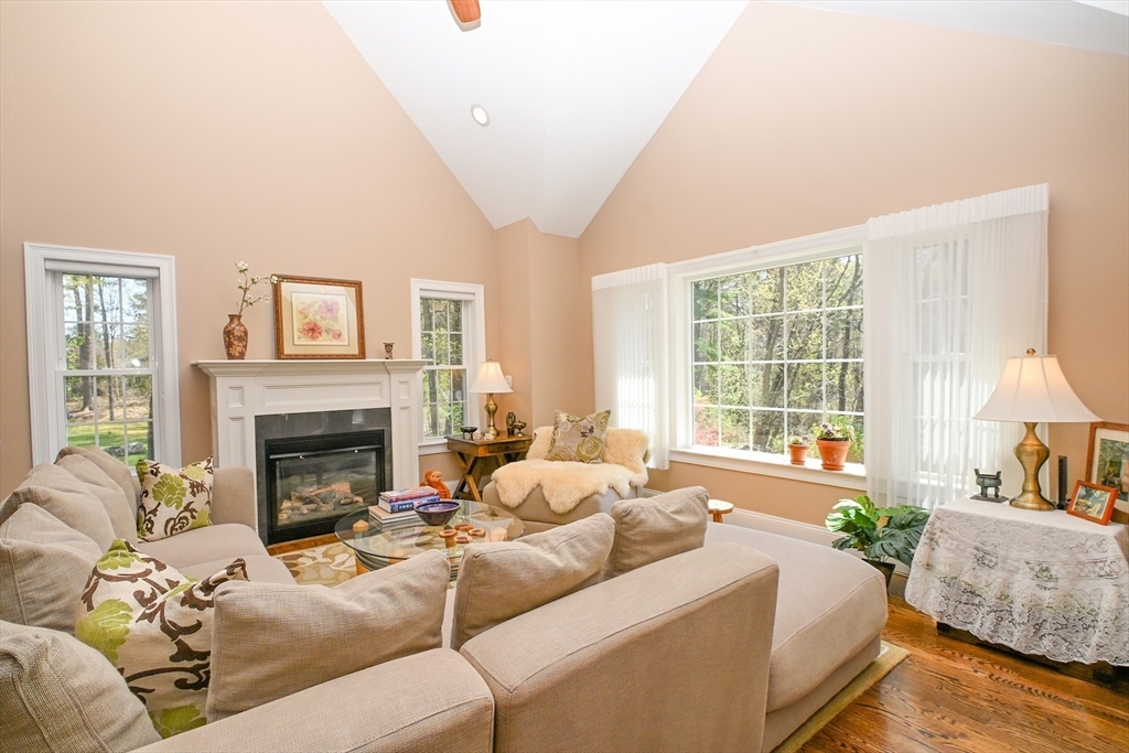 60 Harding Street, Unit C Medfield, MA 02052 - Photo 13 of 41 a living room with furniture and a fireplace